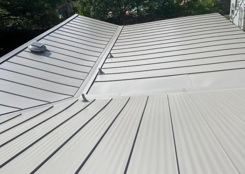 Solar attic fan installed on a metal roof for Roof Ventilation in East Los Angeles
